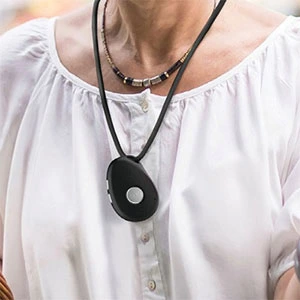 Senior wearing a mobile medical alert pendant with fall detection in Canada