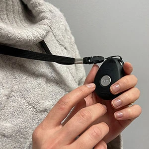Senior wearing medical alert pendant in Canada