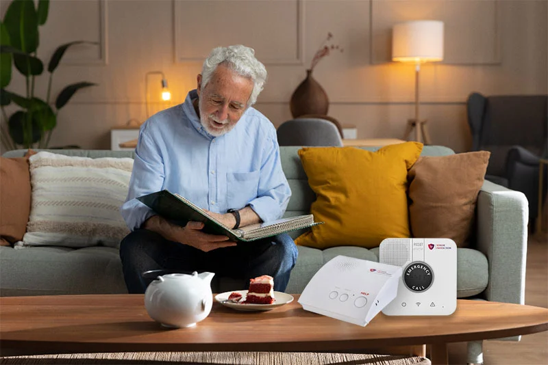 Senior man using Senior Protection medical alert devices in his house in Canada