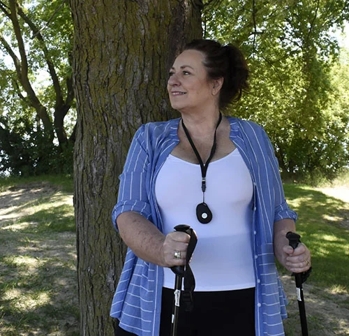 Senior wearing the Senior Protection medical alert pendant
