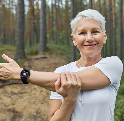 Senior woman wearing our medical alert smartwatch for safety